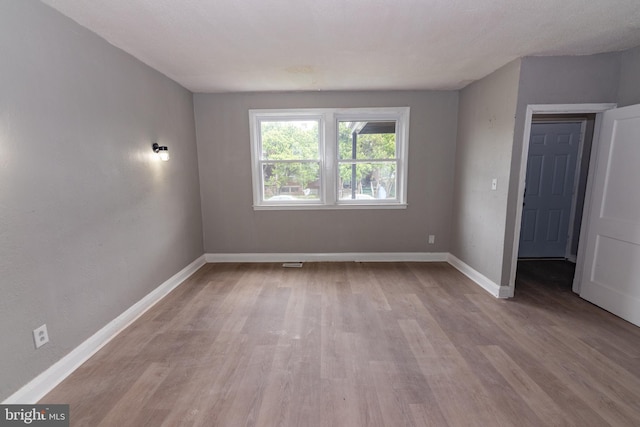 1304 N Linwood Ave, Baltimore, MD 21213 - spare room featuring light wood-type flooring and baseboards