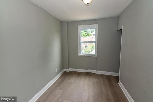 1304 N Linwood Ave, Baltimore, MD 21213 - unfurnished room with wood finished floors and baseboards