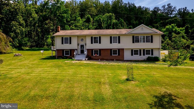 4179 Fiery Run Rd, Linden, VA 22642 - raised ranch featuring a chimney, a front yard, and brick siding