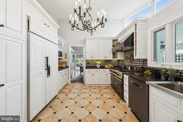 3201/2 Mansion Dr, Alexandria, VA 22302 - kitchen with built in appliances, dark countertops, range hood, white cabinets, and backsplash