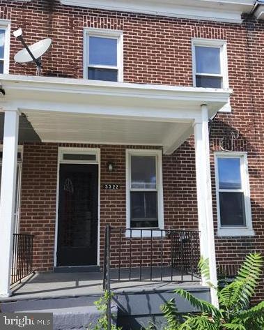 3322 Elmora Ave, Baltimore, MD 21213 - entrance to property with brick siding and covered porch
