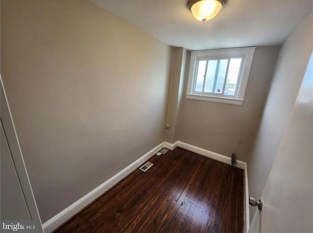 3322 Elmora Ave, Baltimore, MD 21213 - spare room with baseboards and dark wood-style floors