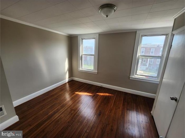 3322 Elmora Ave, Baltimore, MD 21213 - unfurnished room featuring ornamental molding and dark wood-style floors