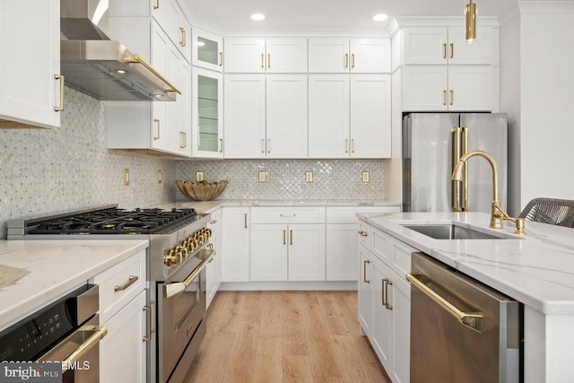 1 Capstan Rd, Waretown, NJ 08758 - kitchen featuring appliances with stainless steel finishes, wall chimney range hood, light wood-style floors, white cabinetry, and recessed lighting