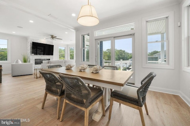 1 Capstan Rd, Waretown, NJ 08758 - dining room featuring plenty of natural light, a fireplace, light wood-type flooring, recessed lighting, and a ceiling fan