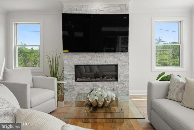 1 Capstan Rd, Waretown, NJ 08758 - living room with a fireplace, wood finished floors, crown molding, and healthy amount of natural light