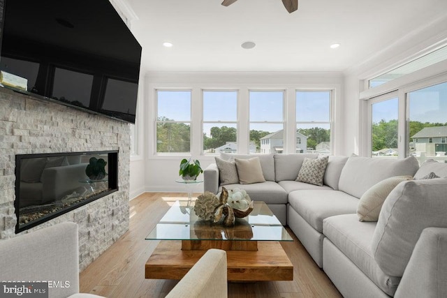 1 Capstan Rd, Waretown, NJ 08758 - living area featuring a fireplace, light wood-type flooring, ornamental molding, and ceiling fan