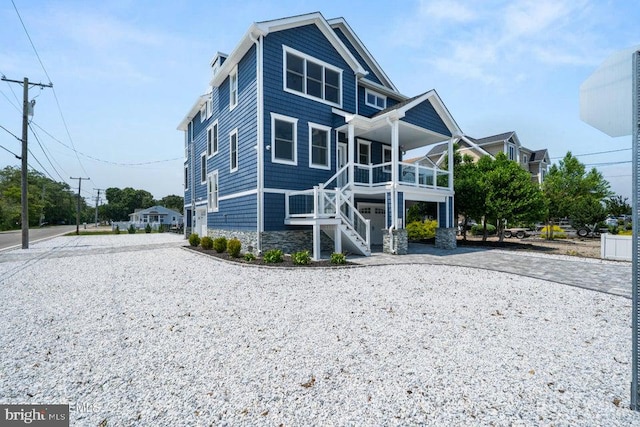 1 Capstan Rd, Waretown, NJ 08758 - rear view of property with driveway, covered porch, stairs, and stone siding