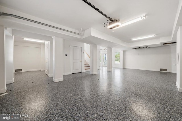 1 Capstan Rd, Waretown, NJ 08758 - garage featuring baseboards and a garage door opener