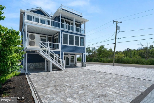 1 Capstan Rd, Waretown, NJ 08758 - coastal home with a balcony, stairs, and a porch