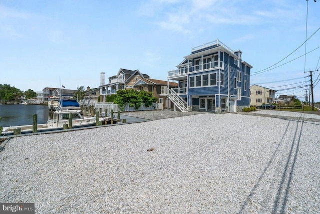 1 Capstan Rd, Waretown, NJ 08758 - rear view of house with driveway, stairs, and a water view