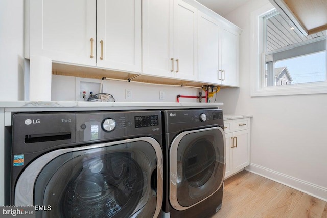 1 Capstan Rd, Waretown, NJ 08758 - laundry room featuring separate washer and dryer, light wood-style flooring, and cabinet space
