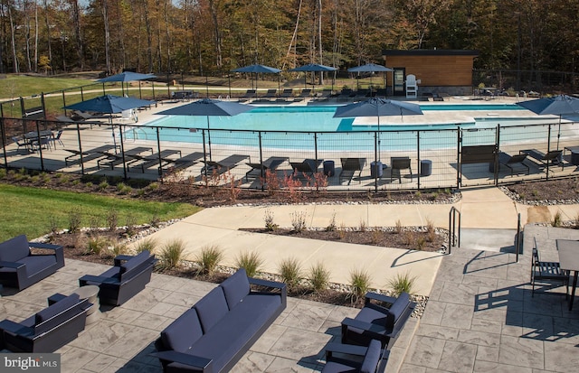 1106 Crested Wood Dr, Laurel, MD 20724 - community pool with an outdoor hangout area, a patio area, and a view of trees