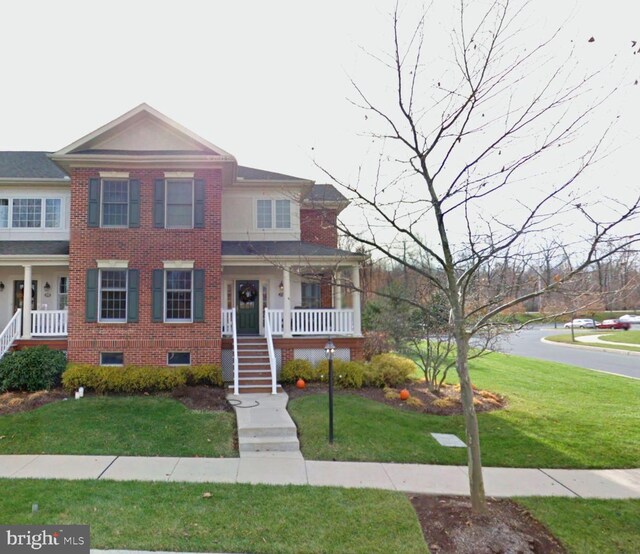 201 Windgate Dr, Chester Springs, PA 19425 - multi unit property featuring a porch, stairs, a front yard, and brick siding