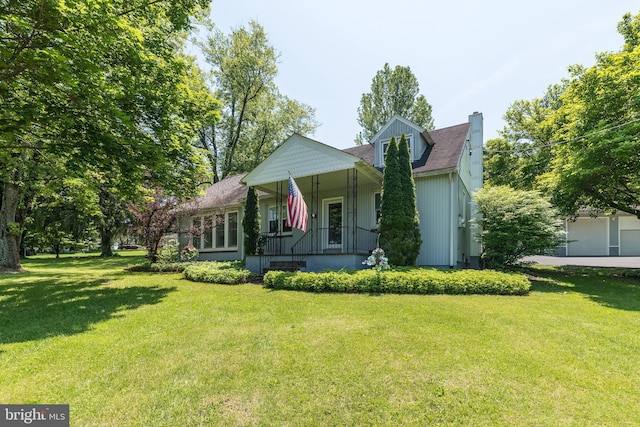 2462 Route Unit 412, Hellertown, PA 18055 - view of front facade featuring a chimney, a front lawn, and covered porch