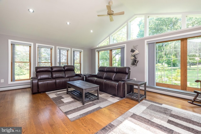 2462 Route Unit 412, Hellertown, PA 18055 - living room with a baseboard radiator, ceiling fan, high vaulted ceiling, wood finished floors, and recessed lighting