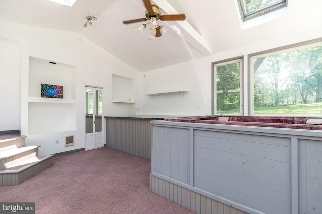 2462 Route Unit 412, Hellertown, PA 18055 - kitchen featuring a skylight, lofted ceiling, plenty of natural light, carpet floors, and ceiling fan