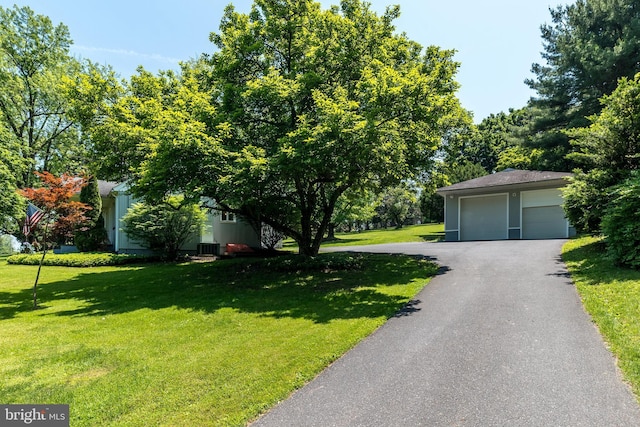 2462 Route Unit 412, Hellertown, PA 18055 - view of front of property with a front yard, an outdoor structure, and a garage
