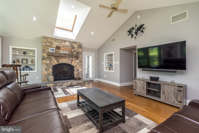 2462 Route Unit 412, Hellertown, PA 18055 - living room featuring built in features, a skylight, wood finished floors, ceiling fan, and high vaulted ceiling