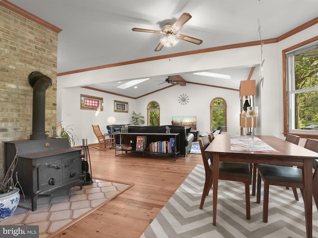 13310 Mockingbird Ln, Bowie, MD 20720 - dining area with a wood stove, a ceiling fan, wood finished floors, and lofted ceiling