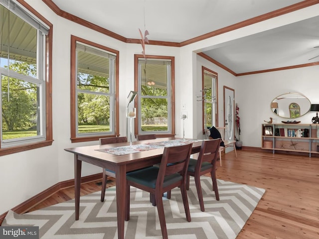 13310 Mockingbird Ln, Bowie, MD 20720 - dining area with light wood-style flooring and crown molding
