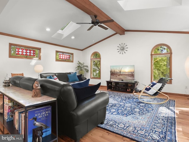 13310 Mockingbird Ln, Bowie, MD 20720 - living room with a skylight, wood finished floors, ceiling fan, recessed lighting, and ornamental molding