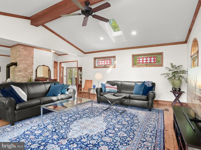 13310 Mockingbird Ln, Bowie, MD 20720 - living room featuring wood finished floors, a ceiling fan, a skylight, and plenty of natural light