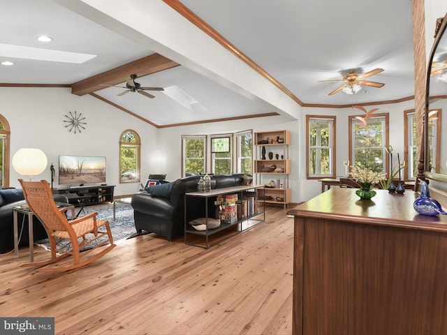 13310 Mockingbird Ln, Bowie, MD 20720 - living room with a skylight, a ceiling fan, light wood-style floors, ornamental molding, and recessed lighting
