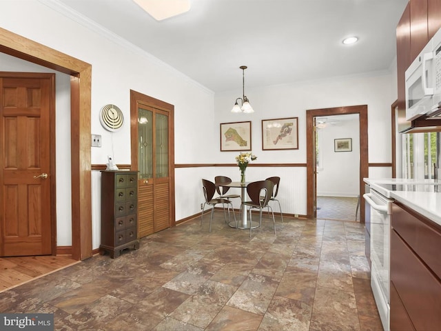 13310 Mockingbird Ln, Bowie, MD 20720 - dining area with crown molding, stone finish flooring, and a chandelier