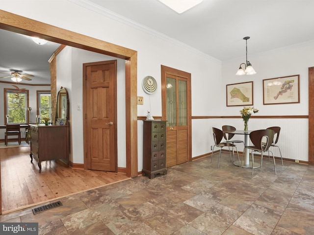 13310 Mockingbird Ln, Bowie, MD 20720 - entryway featuring crown molding, stone finish floors, a chandelier, and a ceiling fan