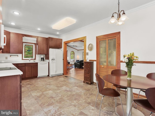 13310 Mockingbird Ln, Bowie, MD 20720 - kitchen featuring white appliances, ornamental molding, a chandelier, light countertops, and plenty of natural light