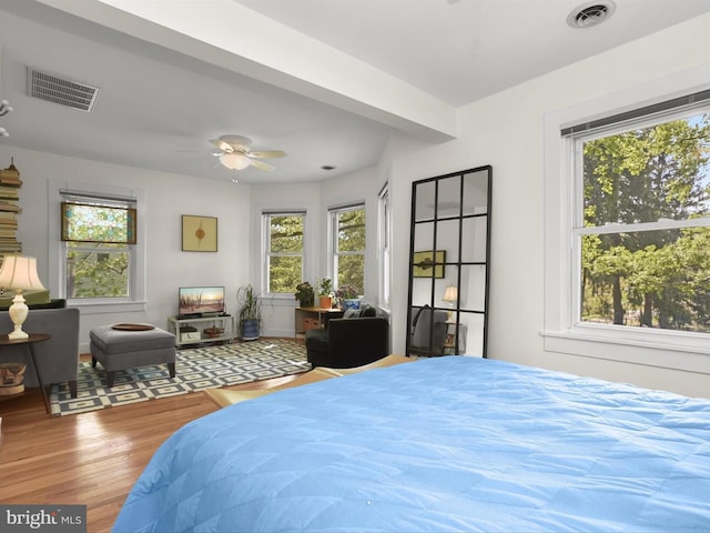 13310 Mockingbird Ln, Bowie, MD 20720 - bedroom with multiple windows and wood finished floors
