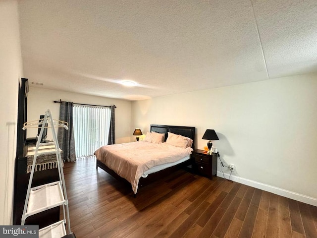 20822 Valley Forge Cir Unit 822, King Of Prussia, PA 19406 - bedroom with a textured ceiling and wood finished floors
