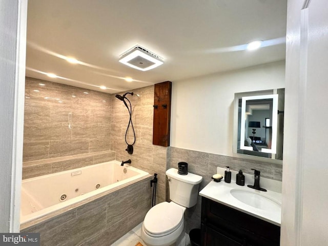 20822 Valley Forge Cir Unit 822, King Of Prussia, PA 19406 - bathroom featuring a combined bath / shower with jetted tub, vanity, and tile walls