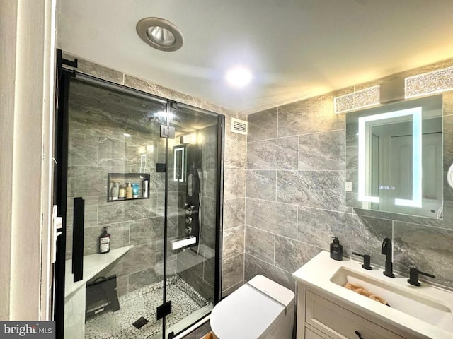 20822 Valley Forge Cir Unit 822, King Of Prussia, PA 19406 - bathroom featuring vanity, a shower stall, and tile walls