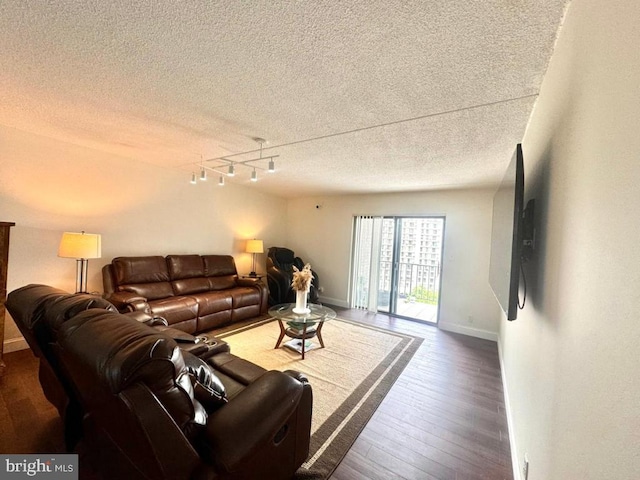 20822 Valley Forge Cir Unit 822, King Of Prussia, PA 19406 - living room with a textured ceiling, track lighting, and wood finished floors