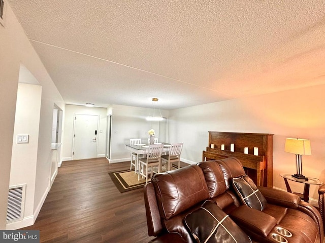 20822 Valley Forge Cir Unit 822, King Of Prussia, PA 19406 - living area with a textured ceiling and dark wood-style flooring