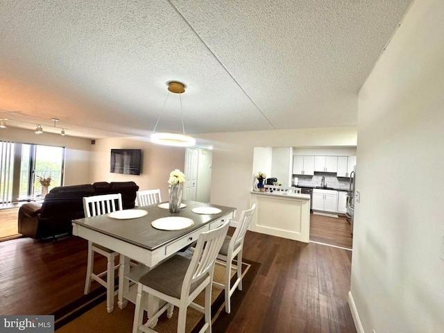 20822 Valley Forge Cir Unit 822, King Of Prussia, PA 19406 - dining space featuring a textured ceiling and dark wood finished floors