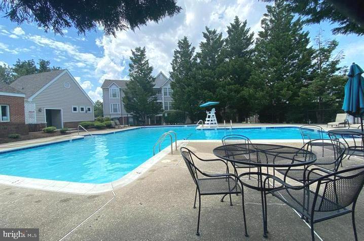 3597 Sherbrooke Cir, Woodbridge, VA 22192 - community pool with a patio area