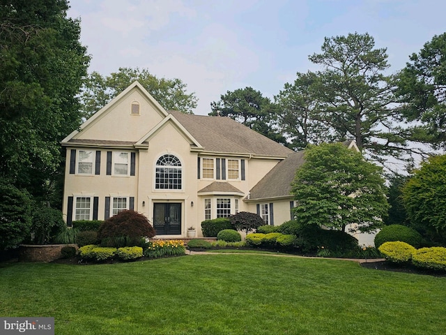 18 Knottingham Dr, Voorhees, NJ 08043 - view of front of house with a front lawn, stucco siding, and french doors