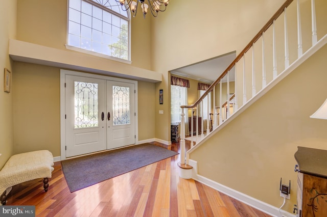 18 Knottingham Dr, Voorhees, NJ 08043 - entryway with a chandelier, a towering ceiling, wood finished floors, stairway, and french doors