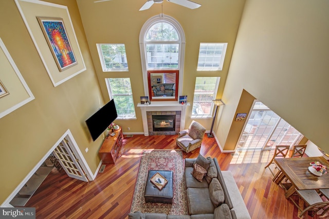 18 Knottingham Dr, Voorhees, NJ 08043 - living area featuring a high ceiling, a tiled fireplace, a ceiling fan, and wood finished floors