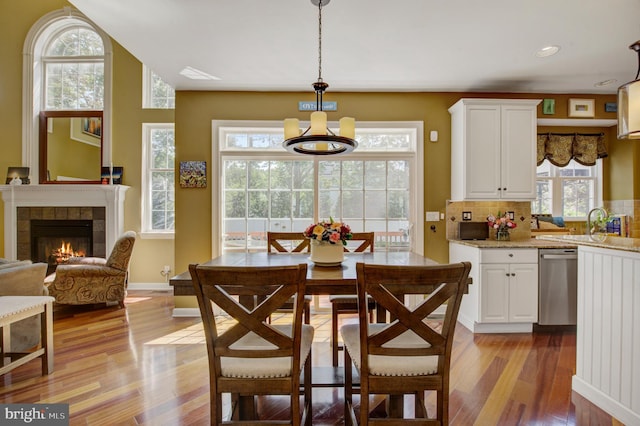 18 Knottingham Dr, Voorhees, NJ 08043 - dining space with light wood-type flooring, a tiled fireplace, and recessed lighting