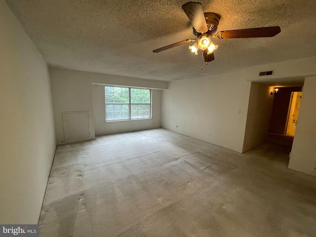 7630 Provincial Dr Unit 307, Mclean, VA 22102 - carpeted spare room with a textured ceiling and ceiling fan