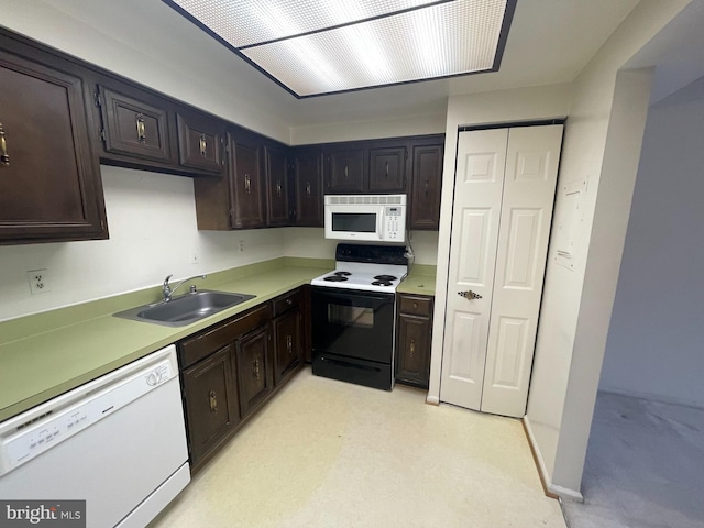 7630 Provincial Dr Unit 307, Mclean, VA 22102 - kitchen featuring white appliances, light countertops, and dark brown cabinetry