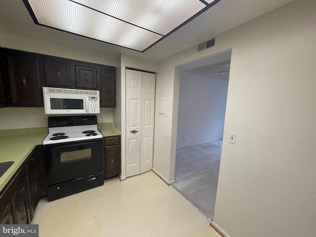 7630 Provincial Dr Unit 307, Mclean, VA 22102 - kitchen with black electric range, white microwave, and light countertops