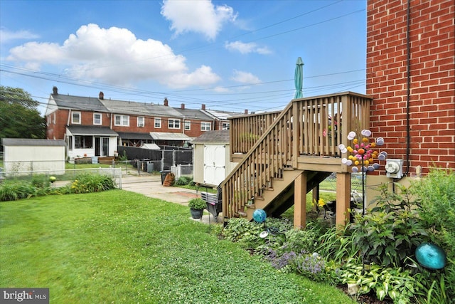 8141 Gray Haven Rd, Baltimore, MD 21222 - back of house featuring brick siding, a storage shed, stairway, and a deck