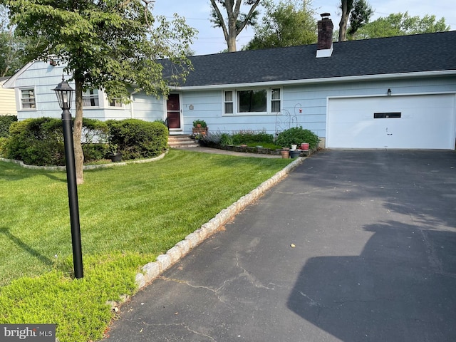 286 Franklin Rd, North Brunswick, NJ 08902 - ranch-style house with driveway, a chimney, an attached garage, a front lawn, and roof with shingles
