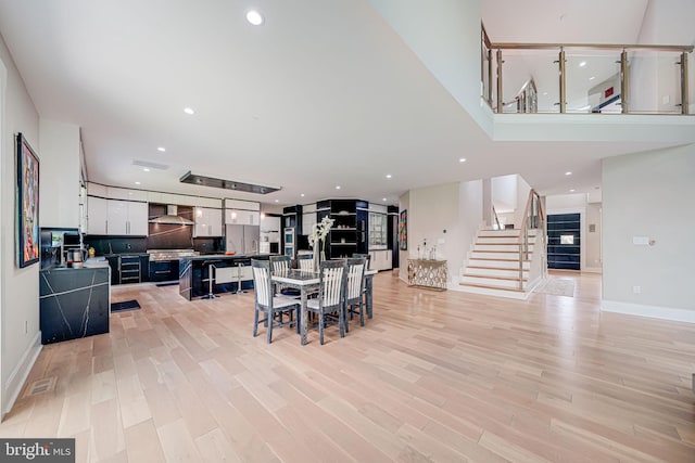 9908 Blake Ln, Oakton, VA 22124 - dining area with stairway, light wood finished floors, and recessed lighting