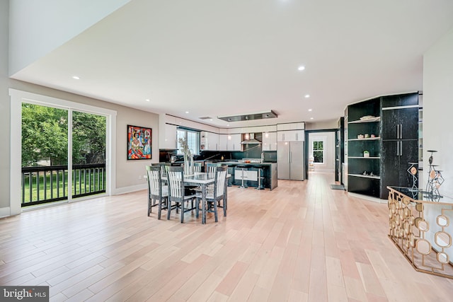 9908 Blake Ln, Oakton, VA 22124 - dining space featuring light wood-style floors and recessed lighting